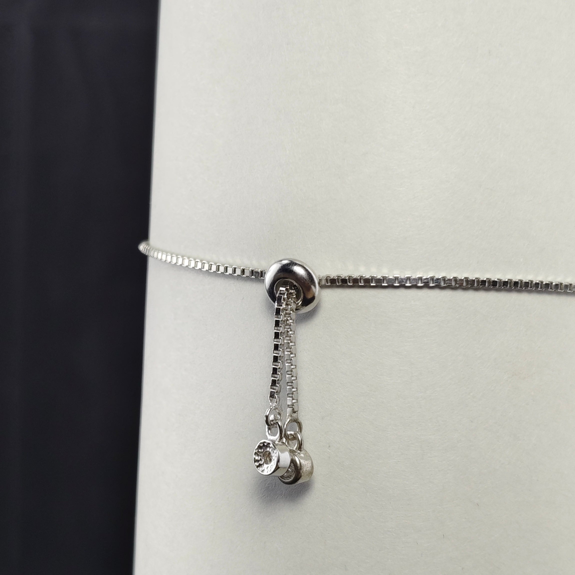 DELICATE SILVER BRACELET WITH EMERALD AND DIAMOND ACCENTS